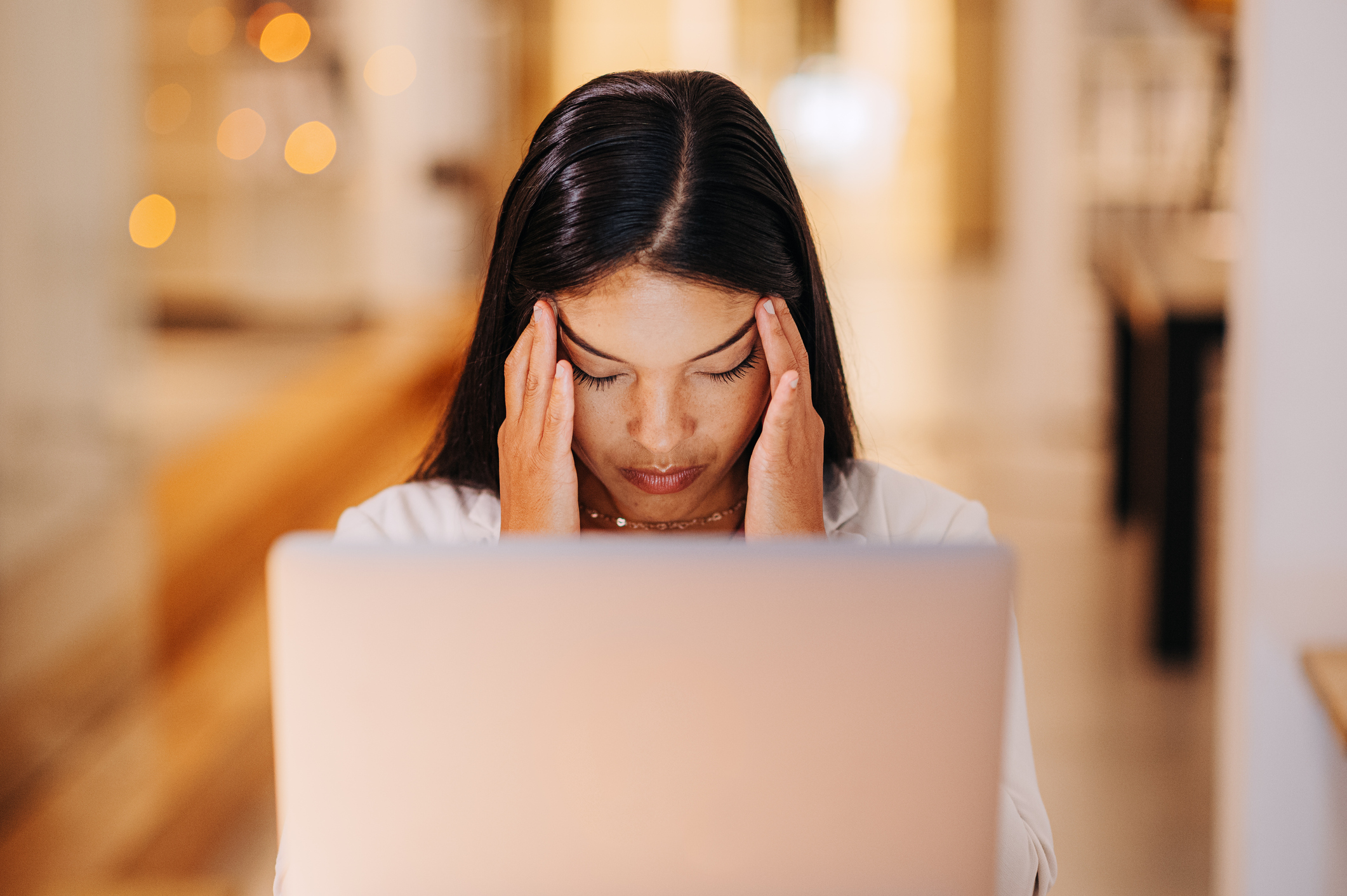 Headache, burnout and stress for woman on laptop doing a social media content writing, internet newspaper or blog article. Home, migraine and freelance writer working to meet target story deadline